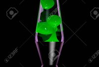 Lava Lamp With Green Lava On Black Background Dark Key Stock Photo with size 866 X 1300