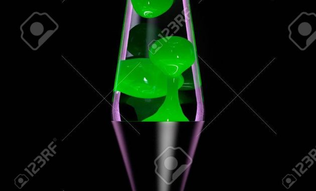 Lava Lamp With Green Lava On Black Background Dark Key Stock Photo with size 866 X 1300