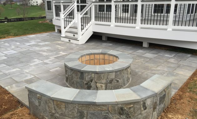 A Beautiful Paver Patio With Stone Seating Walls And A Fire inside sizing 3264 X 2448