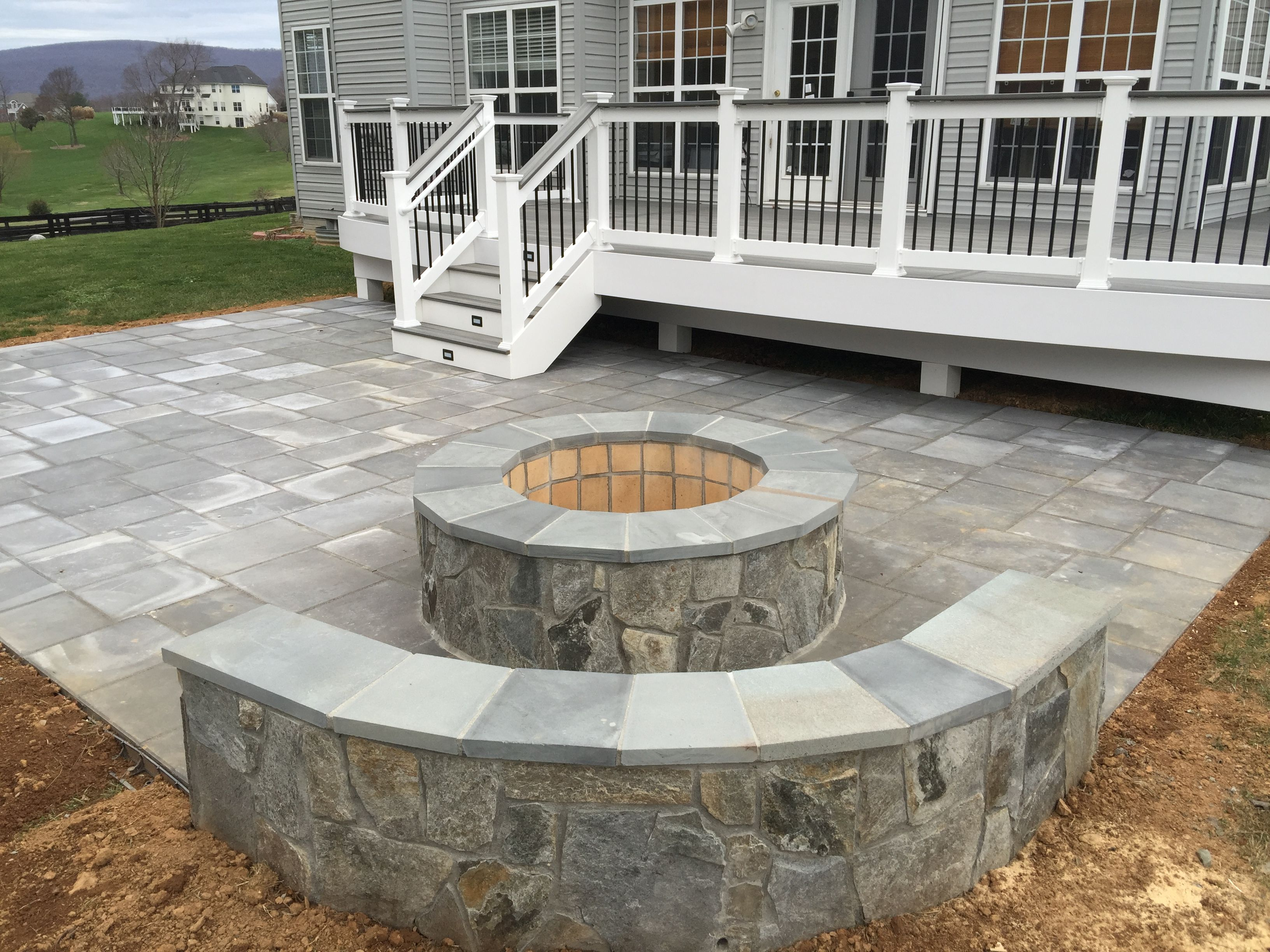 A Beautiful Paver Patio With Stone Seating Walls And A Fire with size 3264 X 2448