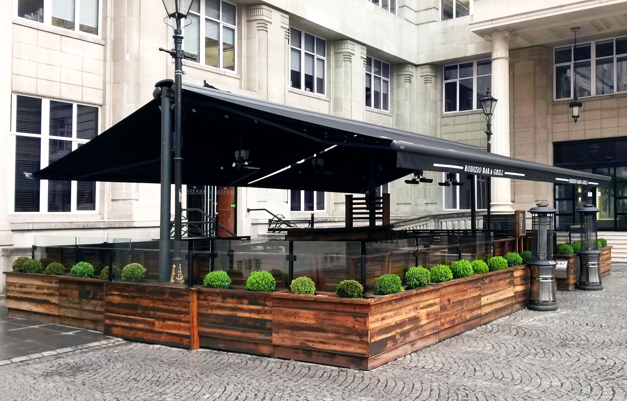 Butterfly Awning With Branded Valances Heaters And Planters for dimensions 2646 X 1694
