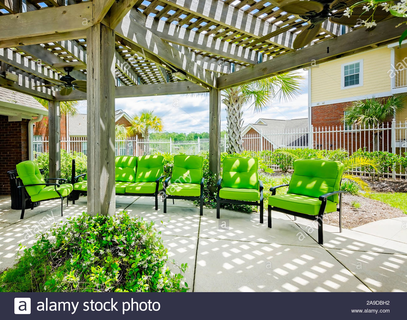 Patio Chairs Are Arranged Beneath A Pergola With Ceiling in sizing 1300 X 1022