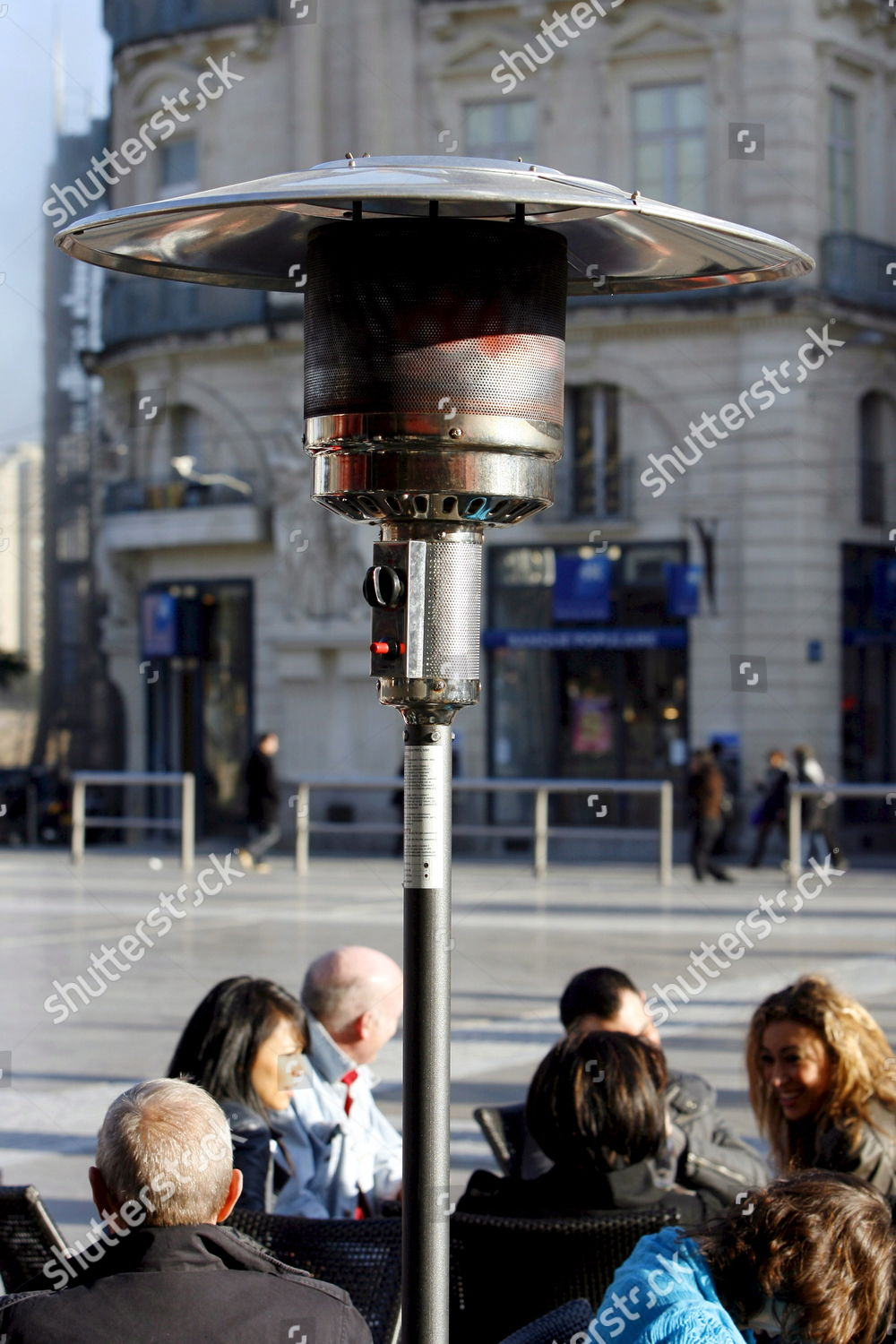People Have Drinks Underneath Patio Heater Montpellier in proportions 1000 X 1500