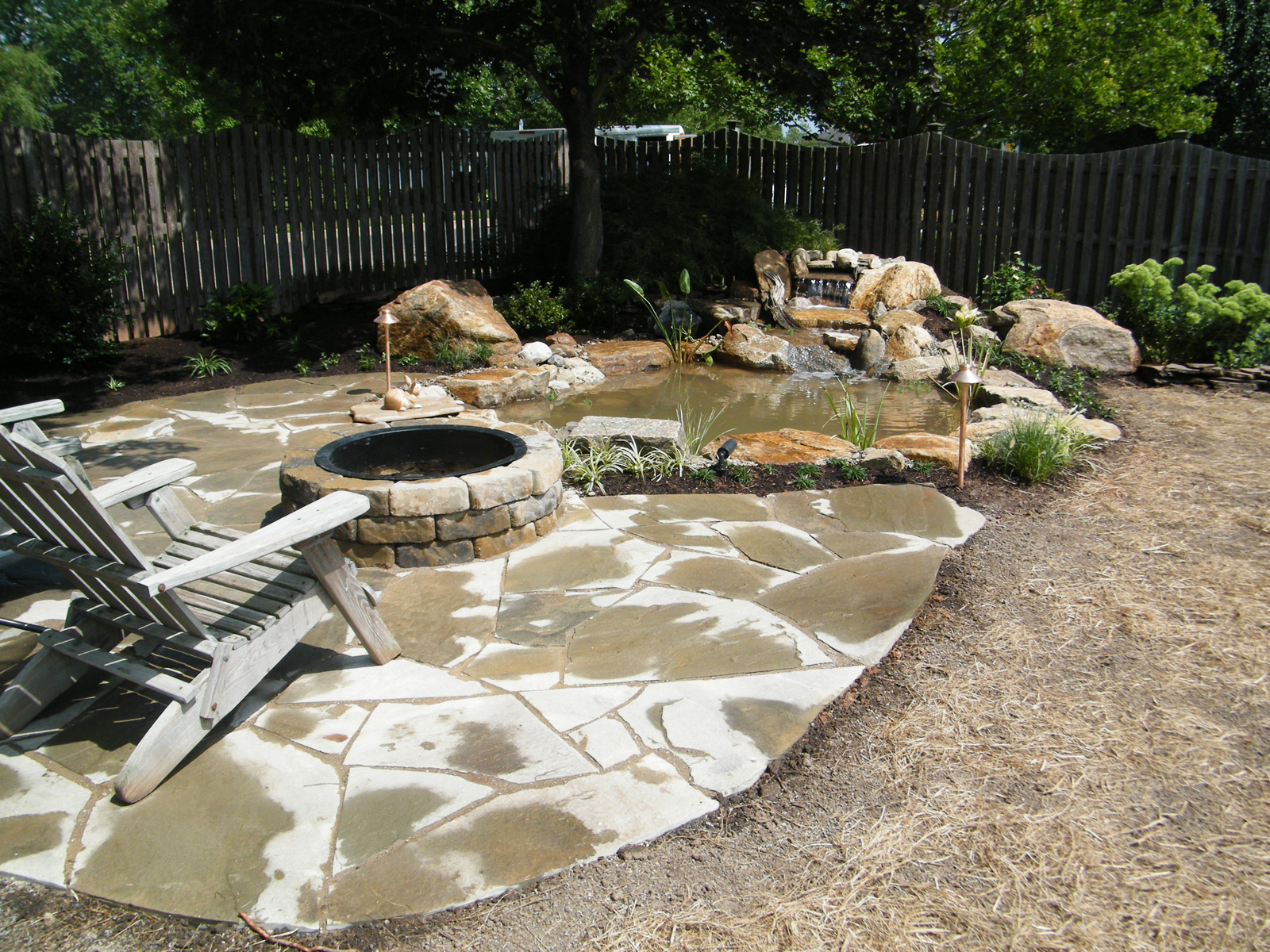 Pond With Irregular Flagstone Patio And Fire Pit Pezzotti in sizing 1600 X 1200