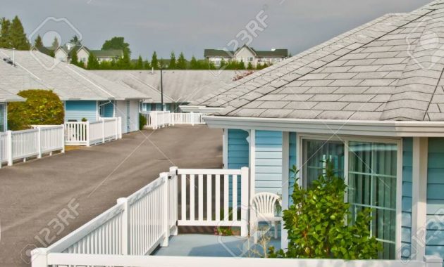 Residential House With Chair And Decorative Tree On Patio Deck regarding proportions 864 X 1300