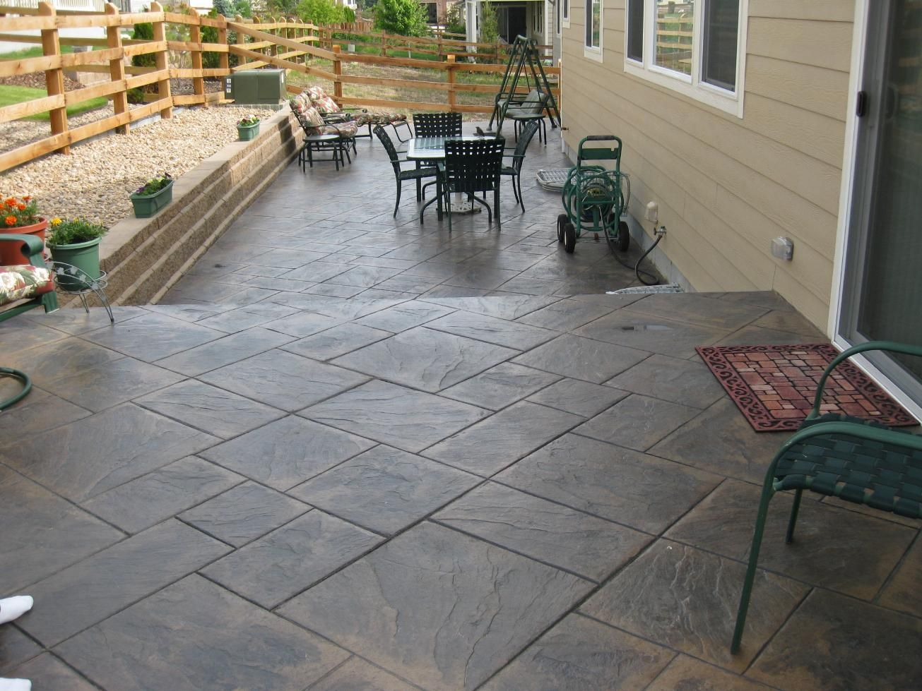 Stamped Concrete Under Deck Patio Decks Take A Walk Down with sizing 1305 X 979