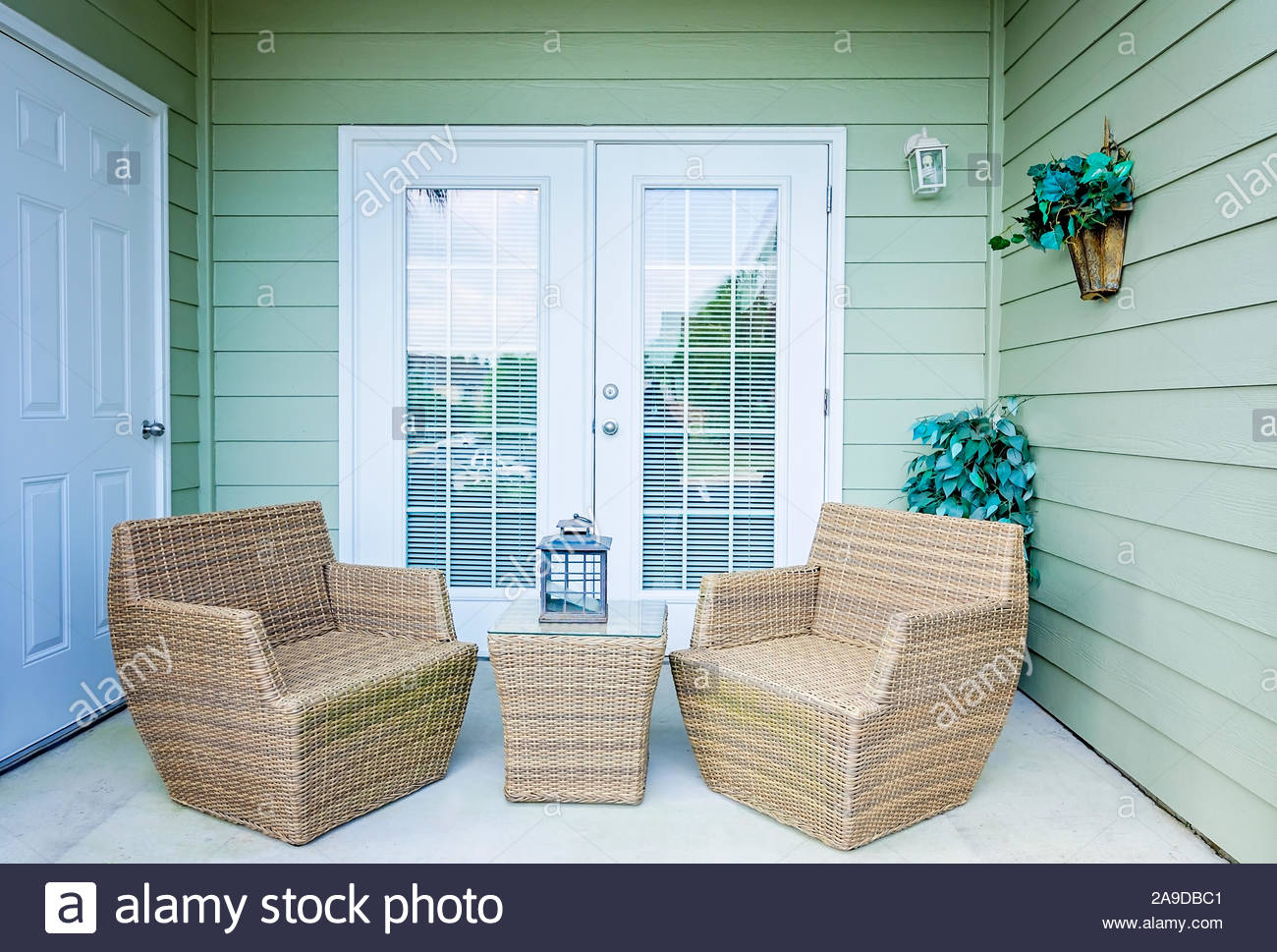 Wicker Chairs Make A Cozy Seating Arrangement On A Patio At regarding proportions 1300 X 969