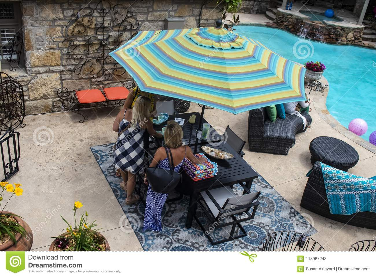 Women Standing Around Patio Table Beside Swimming Pool With with regard to sizing 1300 X 957