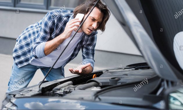 Confused Man Talking On Smartphone And Standing Near Broken throughout sizing 1300 X 957