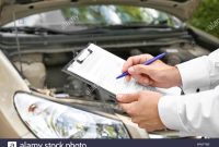 Insurance Agent Near Damaged Car Outdoors Closeup Stock within proportions 1300 X 956