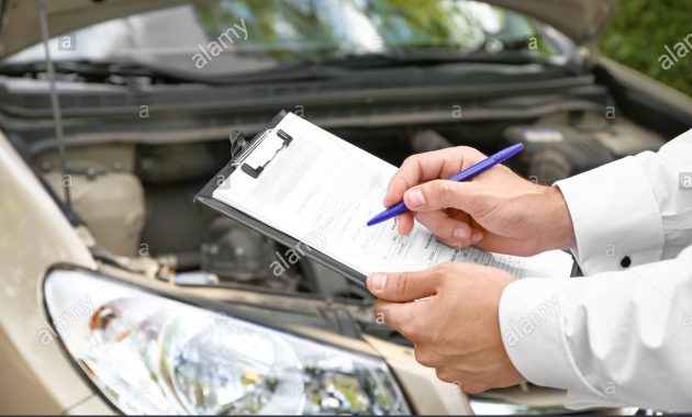 Insurance Agent Near Damaged Car Outdoors Closeup Stock within proportions 1300 X 956