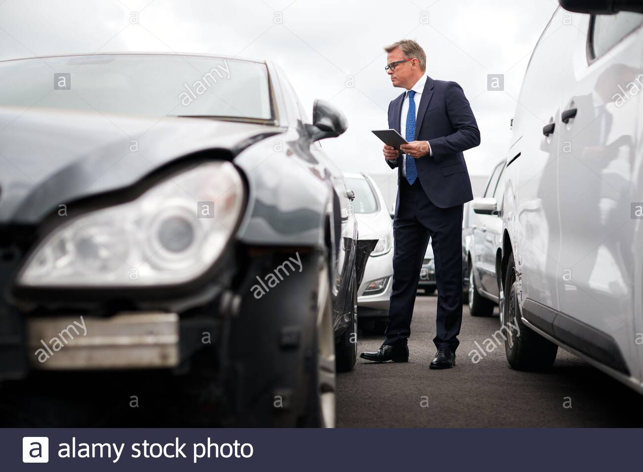 Male Insurance Loss Adjuster With Digital Tablet Inspecting throughout sizing 1300 X 956