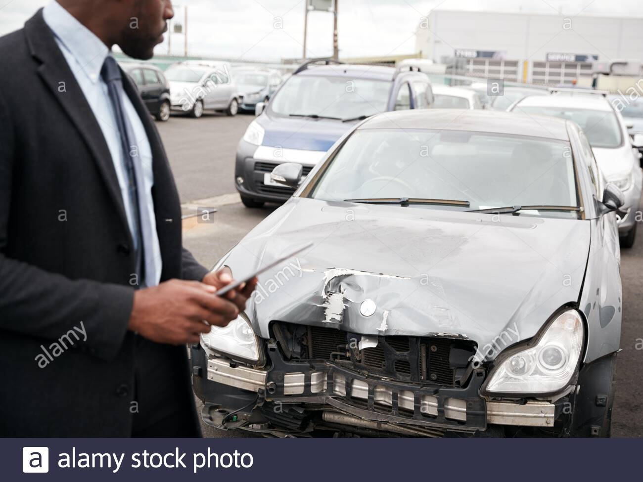 Male Insurance Loss Adjuster With Digital Tablet Inspecting throughout sizing 1300 X 975