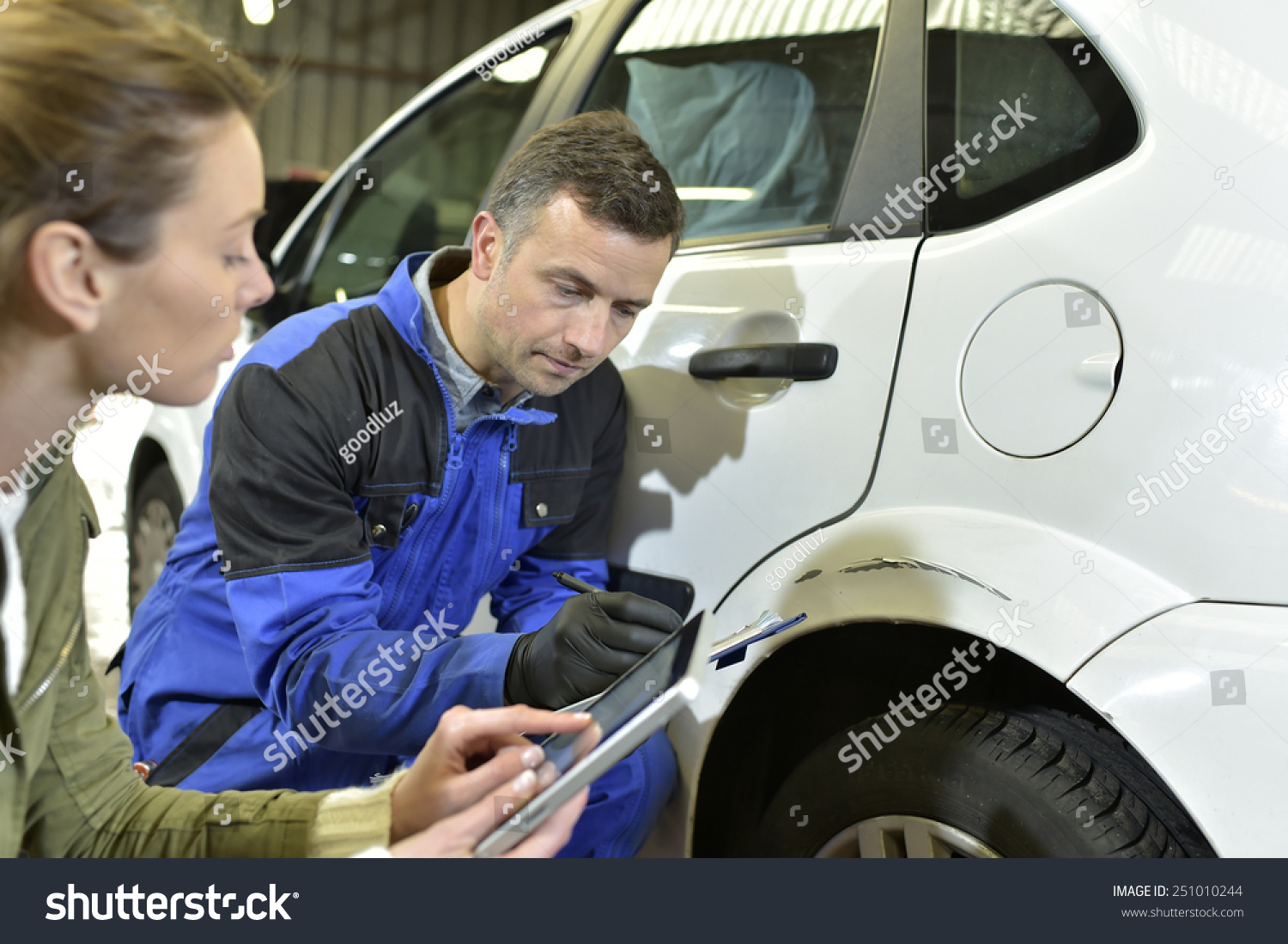 Mechanician Insurance Adjuster Checking On Auto Stock Photo pertaining to measurements 1500 X 1099