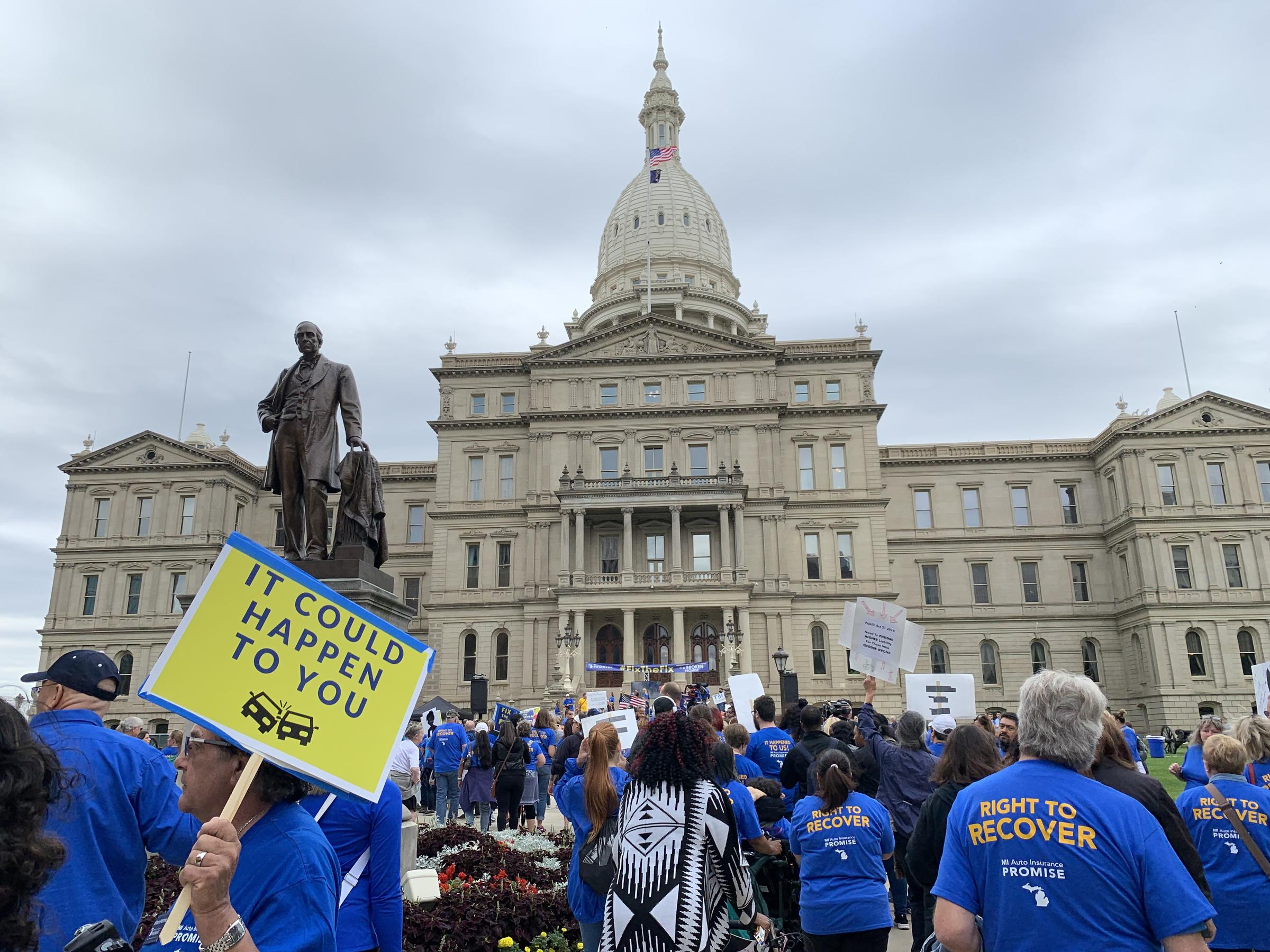 People Rally Against Michigans Auto No Fault Law At The with size 2400 X 1800