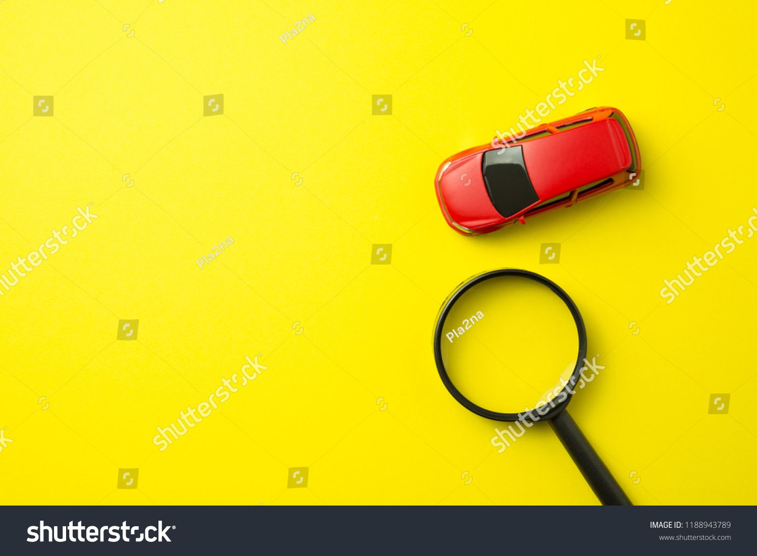 Red Car And Magnifying Glass On Yellow Background With Copy inside proportions 1500 X 1102