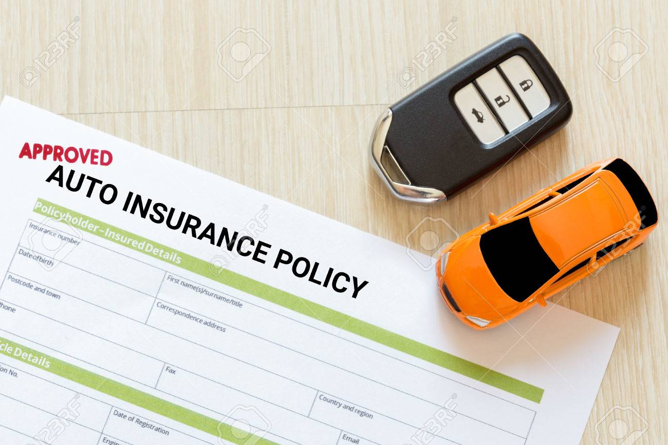 Top View Of Approved Auto Insurance Policy Form With Car Key within dimensions 1300 X 866