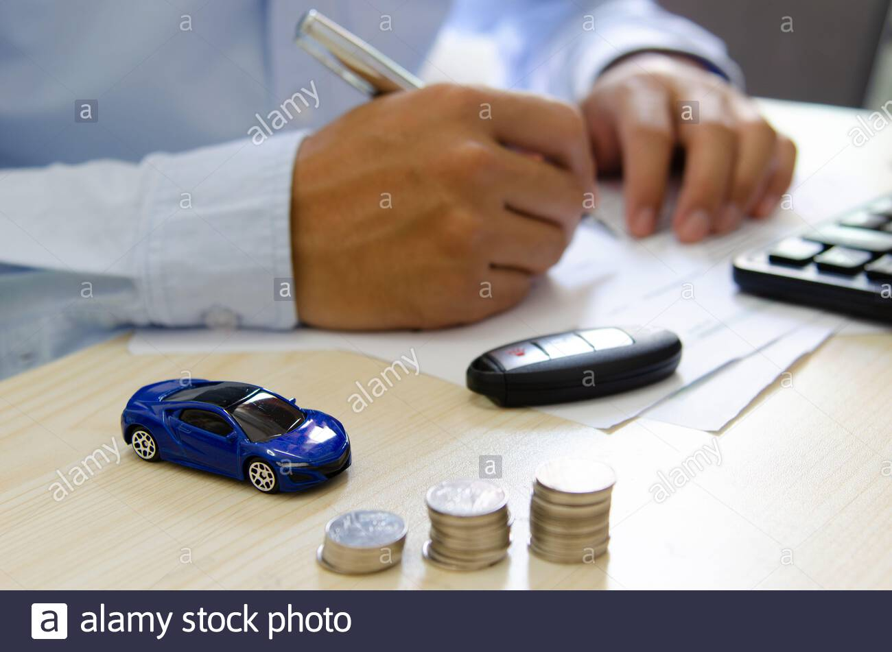 Toy Car Finance Calculator Car Keys And Papers On The Desk for proportions 1300 X 951