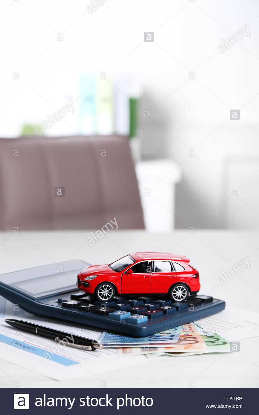 Toy Car Money Documents And Calculator On Table Car for dimensions 866 X 1390